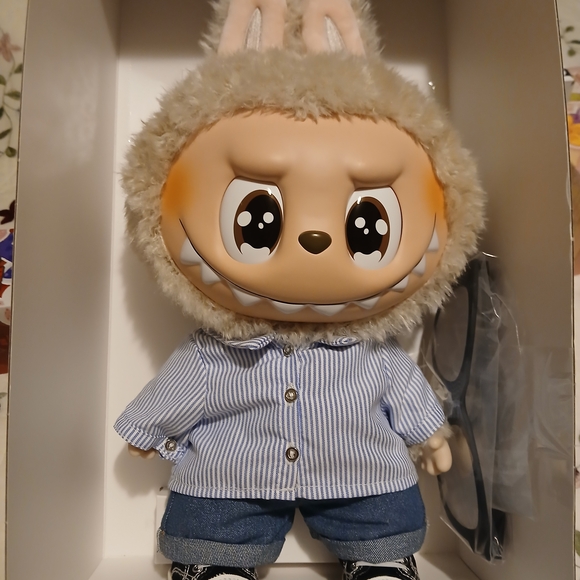 Charming Plush Creature with Striped Blue Shirt - Picture 2 of 10